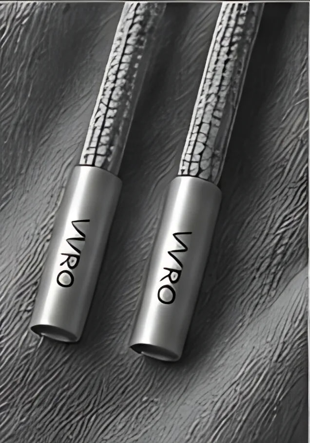 Gray engraved aglets close-up